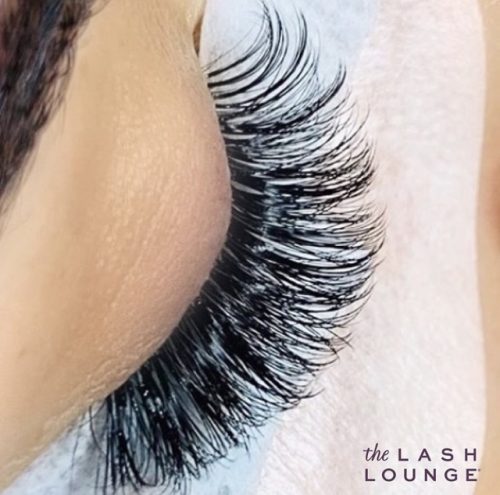 closeup of eye closed with long eyelash extensions full fluffy volume